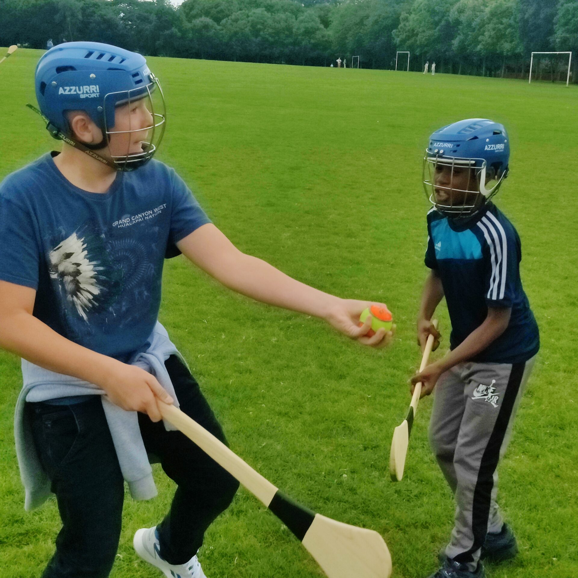 International students learn to play hurling - an Irish sport